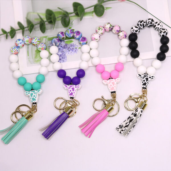O1CN01eDMldV1eDqyfPJFDl_2216524353838-0-cib Wholesale Cow Pattern Cow Head Silicone Beaded Wrist Keychain