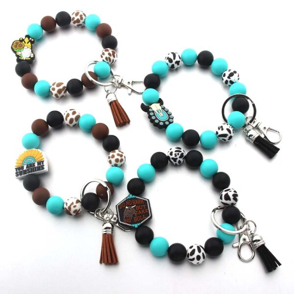 O1CN01gDuWu91bYW4sfX1uM_2216822363477-0-cib Wholesale Cartoon Animal Western Cowboy Silicone Tassel Bracelet Keychain