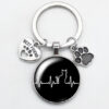 O1CN01gI2LNm1hoRSBuwe5M_2216197114324-0-cib Wholesale Love Cat Pet Footprints Dog Glass Convex Round Metal Keychains