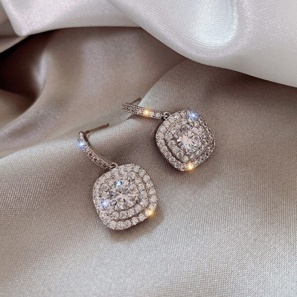 O1CN01geabTL1JJhwI0QStn__3027621008-0-cib Wholesale White Copper Full Diamond Micro Inlaid Earrings