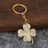 O1CN01hLZgA32KP2dOlNe3B_2213263739548-0-cib Wholesale Diamond Lucky Four-Leaf Clover Car Metal Pendant Keychains