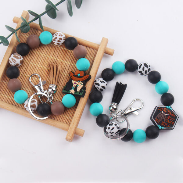O1CN01hUXSHz1NrNliyZsHA_2214899881623-0-cib Wholesale Cartoon Western Style Cow Head Silicone Beaded Wrist Keychain