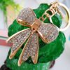 O1CN01hYNoaI1anL724UGKO_2208142583374-0-cib Wholesale Alloy Rhinestone Bow Keychain