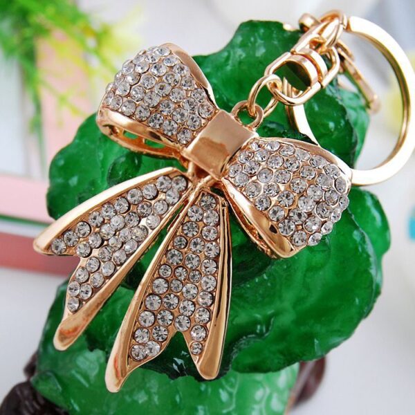 O1CN01hYNoaI1anL724UGKO_2208142583374-0-cib Wholesale Alloy Rhinestone Bow Keychain