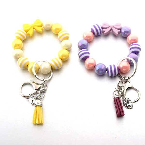 Wholesale Tassel Dragonfly Bull Head Lion Love Angel Acrylic Wrist Keychain