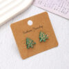 O1CN01jfUqte1ftMUnV7IDb_3172764064-0-cib Wholesale Christmas Carved Leopard Pattern Christmas Tree Wooden Earrings