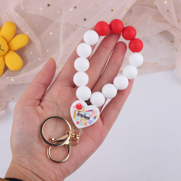 O1CN01juLnai1NrNiDXBolP_2214899881623-0-cib Wholesale Cartoon Love Printed Silicone Beaded Wrist Keychain