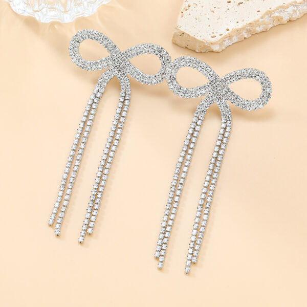 Wholesale Super Flash Claw Chain Bow Tassel Earrings