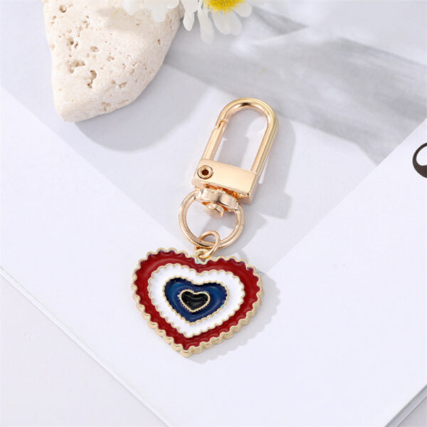O1CN01l3sM9p215p4TIxIgG_4097876934-0-cib Wholesale Irregular Devil's Eye Metal Keychains