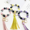 O1CN01lNkx131tKvJOzDcSt_2207986825884-0-cib Wholesale Leopard Print White Bottom Wooden Beads Rubber Paint Round Beads PU Tassel Bracelet Keychain
