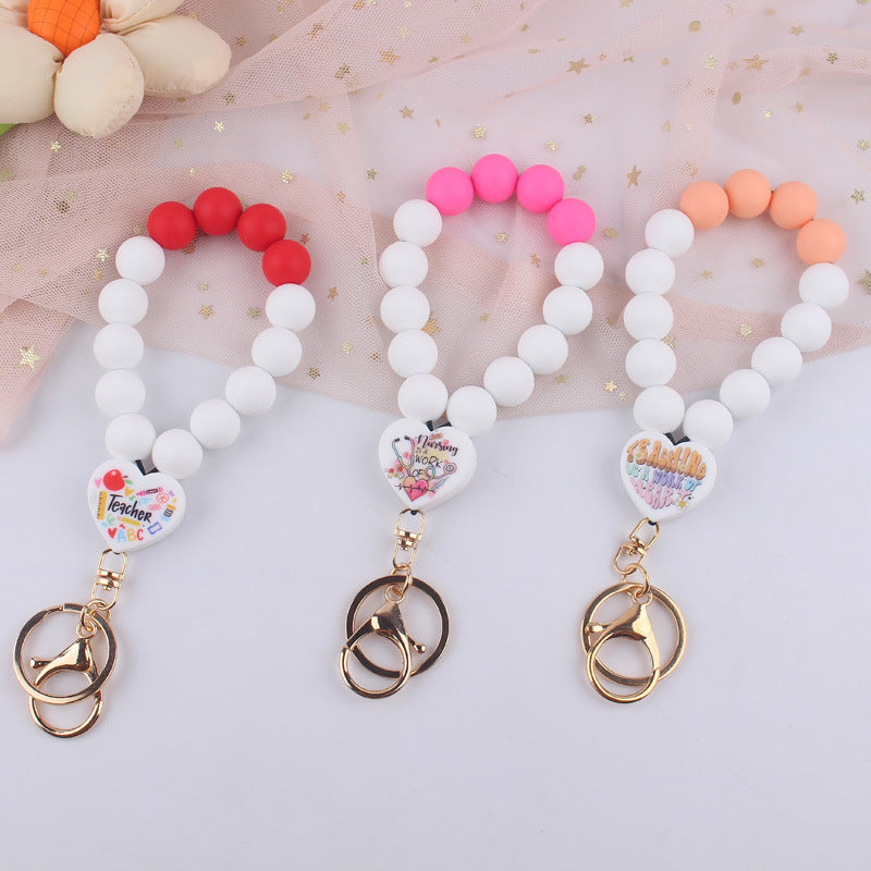 Wholesale Cartoon Love Printed Silicone Beaded Wrist Keychain