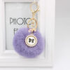 O1CN01nRFm3A1X3abJ3vi3T_2038122868-0-cib Wholesale New Bow Tag Imitation Rex Rabbit Fur Plush Ball Keychain