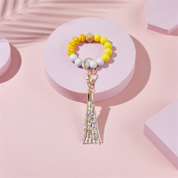 O1CN01oIiAkE2GBWJFYDaJM_2213317938977-0-cib-1 Wholesale basketball, football, rugby Silicone Beaded Wrist Keychain