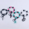 Wholesale Cartoon Bull Head Aztec Cross Silicone Beaded Wrist Keychain
