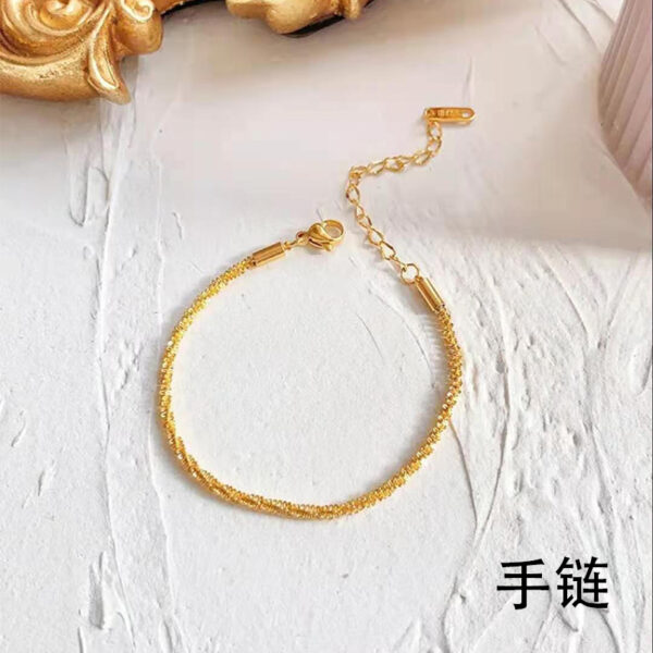 O1CN01osqllb1mNwXFfMtiO_2214535184943-0-cib Wholesale Sparkling Twist Chain Titanium Steel 18K Gold Bracelet