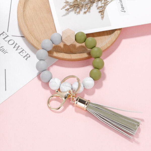 O1CN01ox1rIj1iSk7r1b4ct_3527034412-0-cib-1 Wholesale Silicone Beaded PU Leather Tassel Wristlet Keychain