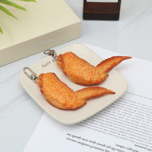 O1CN01p0gDsP1c3enujpLqz__2212435263545-0-cib Wholesale PVC Simulation Orleans Grilled Wings Food Creative Keychain
