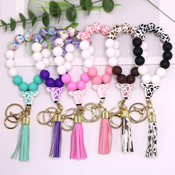 O1CN01qHl6NN1eDqyZHdgZX_2216524353838-0-cib Wholesale Cow Pattern Cow Head Silicone Beaded Wrist Keychain