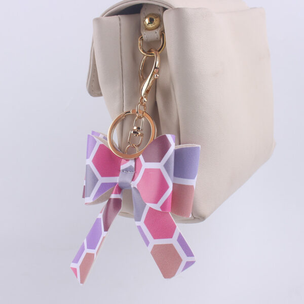 O1CN01qKP50t1NrNf29VC7L_2214899881623-0-cib Wholesale Cartoon Aztec Color Bow Leather Keychain