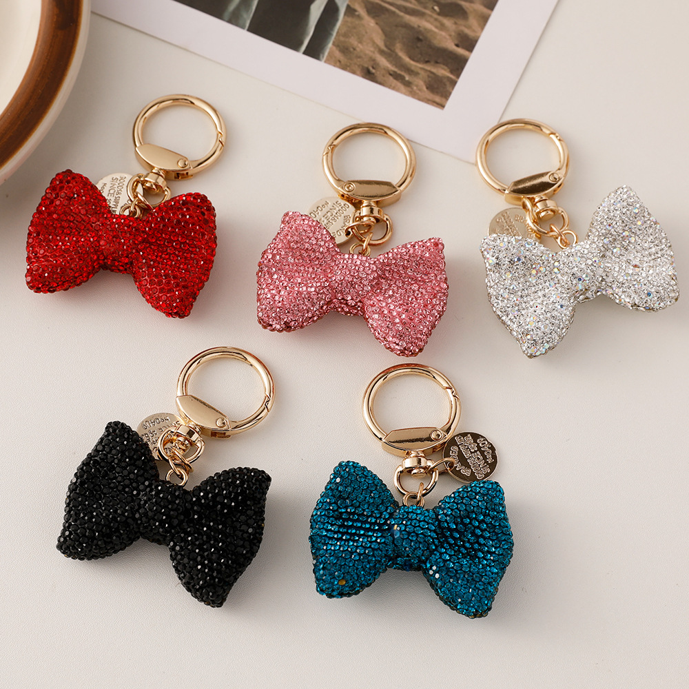 Wholesale European and American cross-border full diamond bow car keychain creative small tag spring ring metal accessories bag decoration