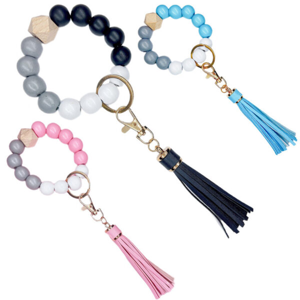 O1CN01rhRGmr1bFjd6eeyJD_2857743436-0-cib-1 Wholesale Wood Imitation Silicone Beads Tassel Wrist Keychain