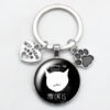 O1CN01roQHD81hoRSBv0fj2_2216197114324-0-cib Wholesale Love Cat Pet Footprints Dog Glass Convex Round Metal Keychains