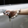 Wholesale Alloy Small Daisy Wristband Keychain