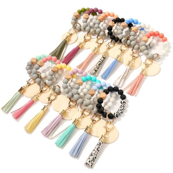 O1CN01s3fcgi1b726mNeX9w_2208367413417-0-cib Wholesale Blank Wooden Brand Fringed Silicone Beads Wrist Key Chain