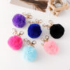 Wholesale of Cute Diamond Inlaid Angel Fur Ball Metal Keychains