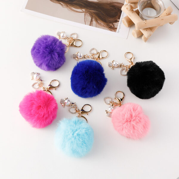 Wholesale of Cute Diamond Inlaid Angel Fur Ball Metal Keychains