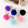 Wholesale of Cute Diamond Inlaid Angel Fur Ball Metal Keychains