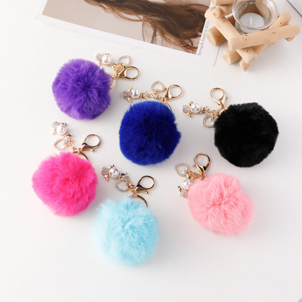 Wholesale of Cute Diamond Inlaid Angel Fur Ball Metal Keychains