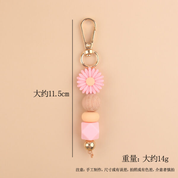 O1CN01sNCV2U1NrNfikw5gA_2214899881623-0-cib Wholesale Silicone Cartoon Daisy Keychains