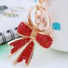 O1CN01stNBlR1anL79OQhdV_2208142583374-0-cib Wholesale Alloy Rhinestone Bow Keychain