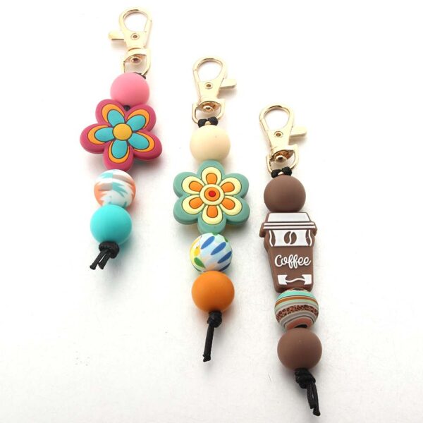 O1CN01swf7Zq1bYW5PiZAAq_2216822363477-0-cib Wholesale Cartoon Flower Coffee Silicone Beads Keychain