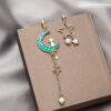 O1CN01t2a05e1onFsgVxS33_2059265269-0-cib Wholesale Cat Moon Star Long Tassel Alloy Earrings