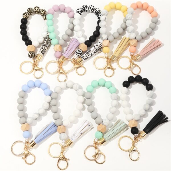 O1CN01tPxHK11b721ygZyia_2208367413417-0-cib-2 Wholesale Silicone Beads Tassels Bracelet Keychain