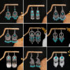Wholesale Hollow Circular Flower Tassel Alloy Earrings