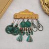 Wholesale Vintage Sunflower Feather Tassels Ethnic Style Round Hollow Alloy Earrings
