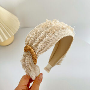 Beige headband with rough edges