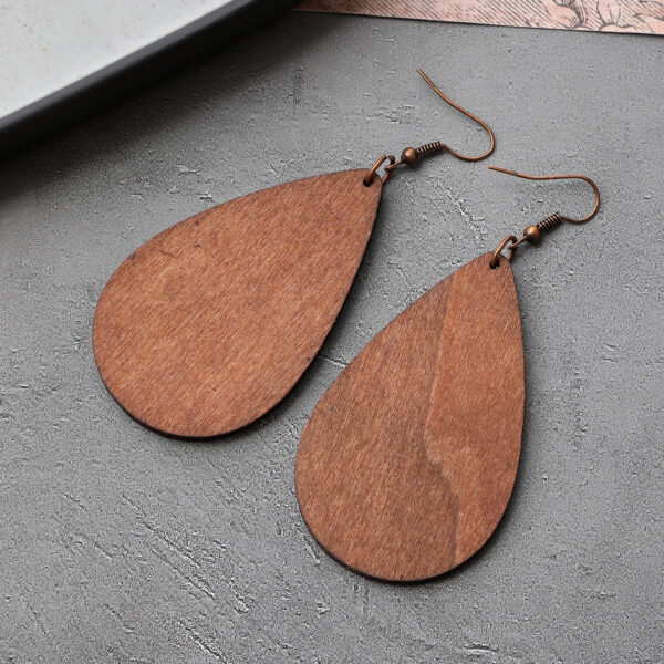 O1CN01vP6j0i1ftMTytzPz1_3172764064-0-cib Wholesale Western Style Cow Head Retro Aztec Pattern Cow Pattern Leather Wood Chip Earrings