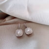 O1CN01x47Rax1JJhwKhxNMO_3027621008-0-cib Wholesale White Copper Full Diamond Micro Inlaid Earrings