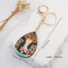 O1CN01xen2v21jN4zpt8y6h_2213351114535-0-cib Wholesale Western Leopard Cow Sun Flower Metal Keychain