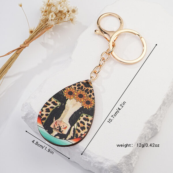 O1CN01xen2v21jN4zpt8y6h_2213351114535-0-cib Wholesale Western Leopard Cow Sun Flower Metal Keychain