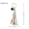 O1CN01ys33MK1bFjfHUdl70_2857743436-0-cib Wholesale PU Cow Pattern Tassel Keychain