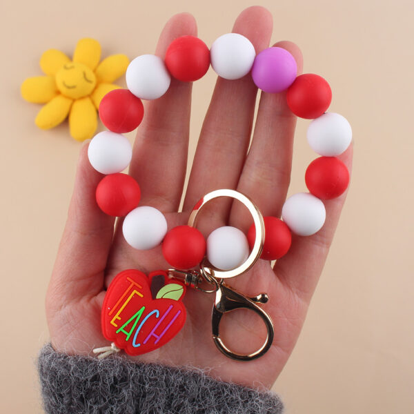 O1CN01z3xZSe1NrNimvM24Q_2214899881623-0-cib-1 Wholesale Cartoon Apple Teacher Pencil Silicone Beaded Wrist Keychain