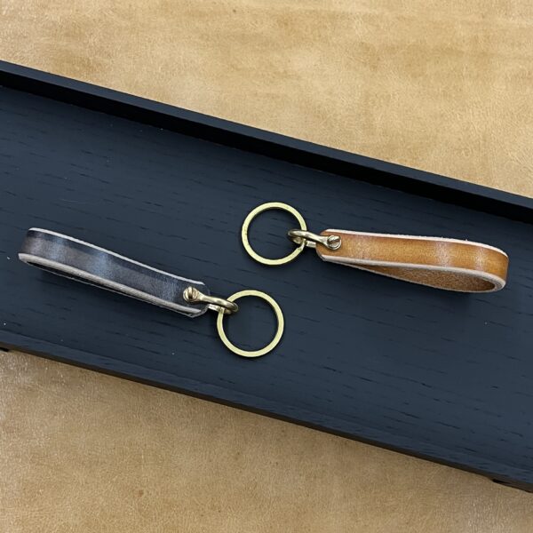 O1CN01zSL9RG1Zlg1V3NnCx_2200807573235-0-cib Wholesale Genuine Leather Brass Horseshoe Chain Keychains