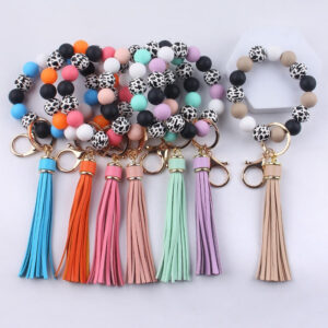 b8c7f65cfd22e023421df2f99c90efd7 Wholesale Leather Tassel Silicone Beads Wooden Beads Bracelet Keychain