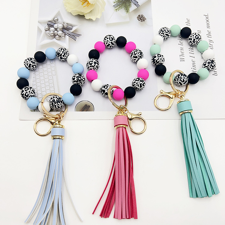 Wholesale Black leopard print wooden bead keychain with white background
