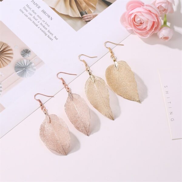 Wholesale Vintage white long hollowed out leaf earrings